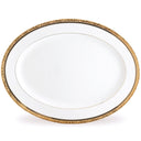 White dinner plate with gold decorative rim on a white background