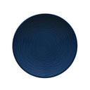 Blue textured plate on a gray background