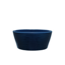 Blue ceramic bowl on a light gray background