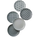 Set of six black and white patterned plates on a white background