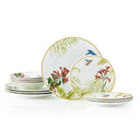 Set of ceramic plates with floral and bird designs on a white background
